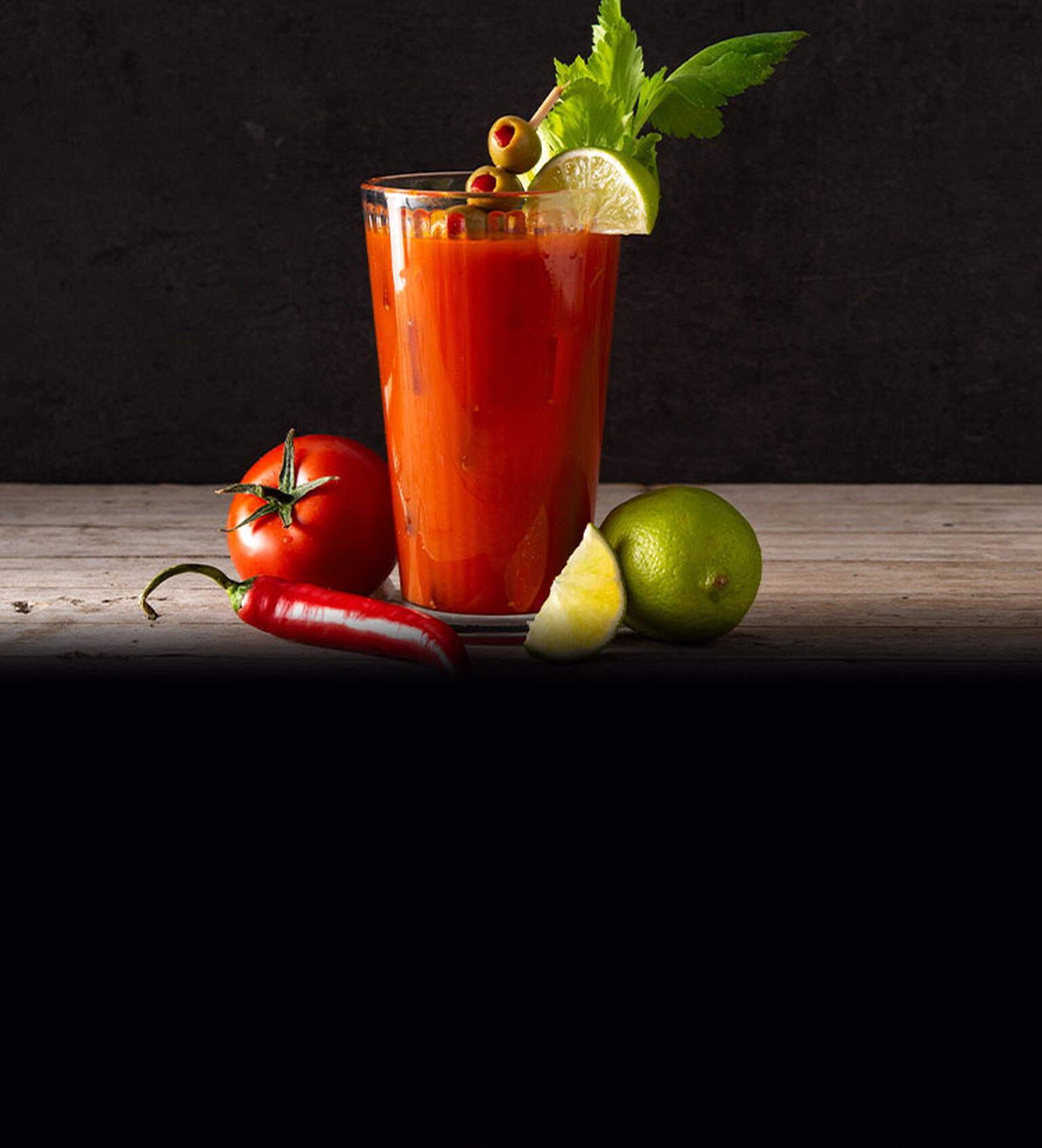 Image of a Bloody Mary cocktail on a butcher block counter